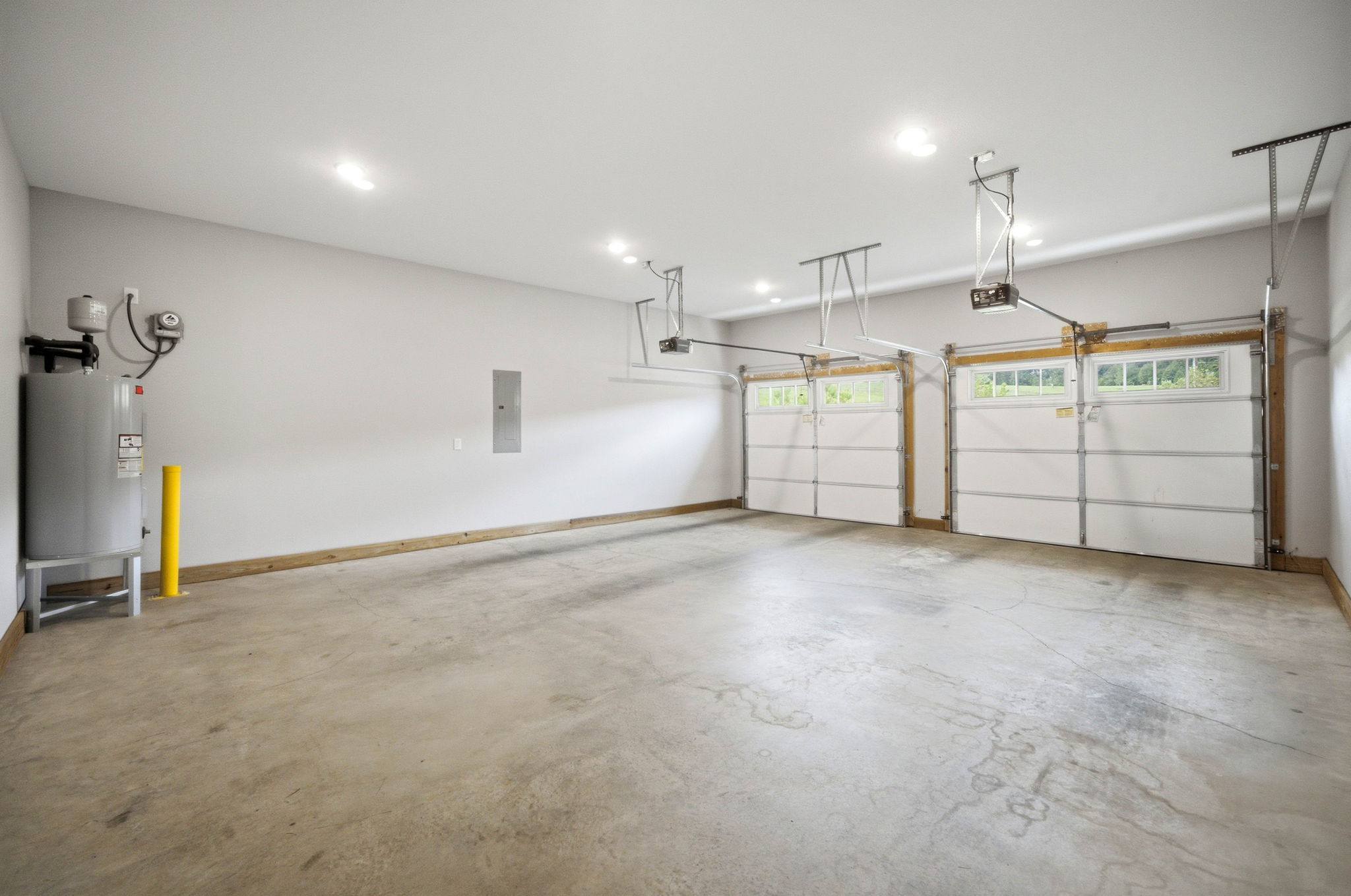 Private two-car garage provides secure parking, direct entry, and valuable additional storage.